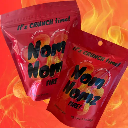 Two red packages of 'Nom Nomz Fire' snacks on a fiery background